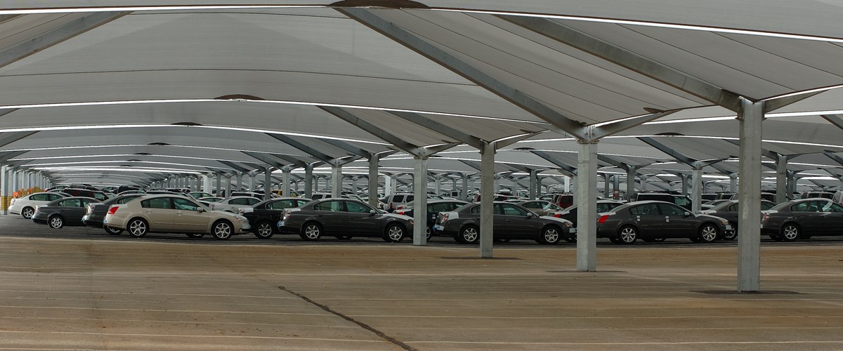 View from inside shade structure with cars parked thumbnail