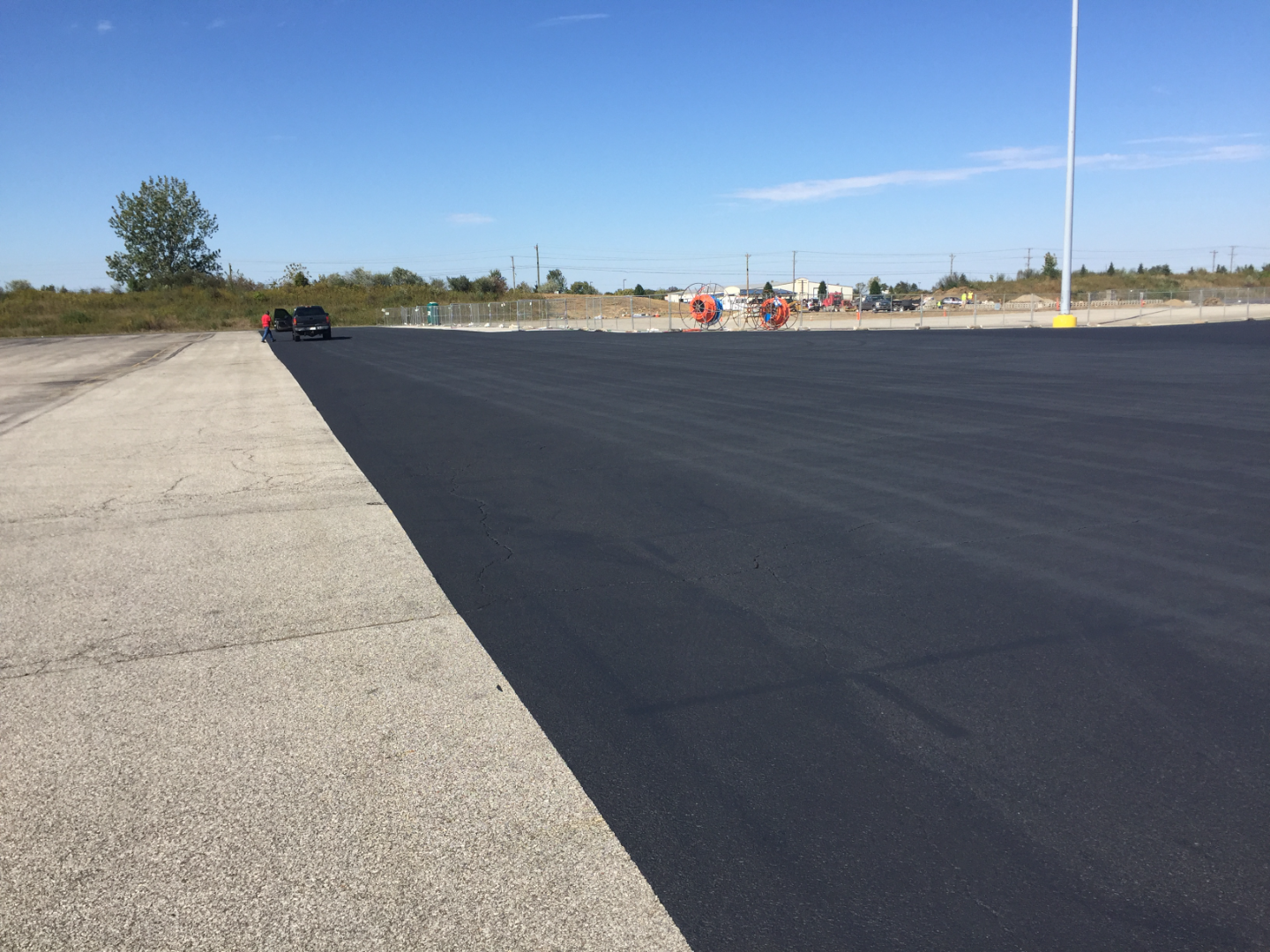 Seal coating asphalt surface